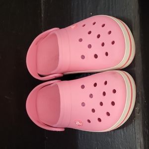 Crocs in Pink with pink stripe on side, logo on back